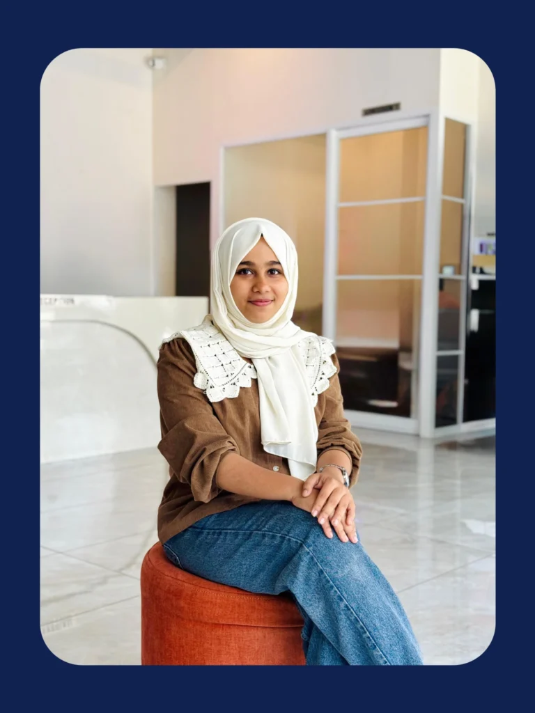 young freelance digital marketer in Malappuram sitting confidently in workspace